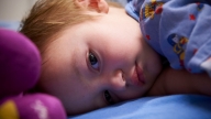 Child in hospital laying down