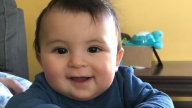 baby boy smiling at camera