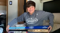 Zach displaying his baseball bats