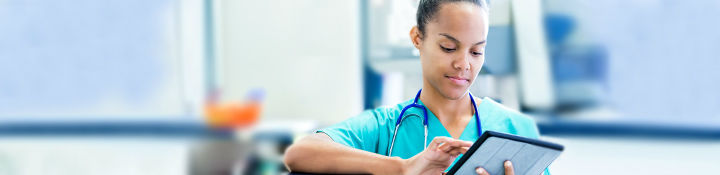 Doctor using electronic tablet