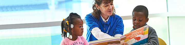 Woman reading to children