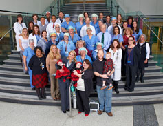 Group photo with clinical staff and the twins