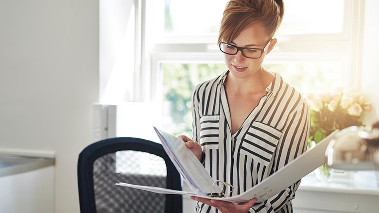 Woman with binder in an office